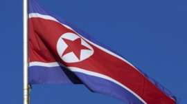 A North Korean flag flies on a mast at the Permanent Mission of North Korea in Geneva October 2, 2014.