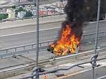 The car burst into flames when it hit the central reservation of the motorway 