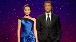 This 2013 photo released by Madame Tussauds shows wax figures resembling married actors Angelina Jolie Pitt, left, and Brad Pitt. The couple's pending divorce has prompted Madame Tussauds to move the wax figures of the stars at their museums in London, New York, Las Vegas and Hollywood to a "respectful distance from each other." (Madame Tussauds via THE ASSOCIATED PRESS)